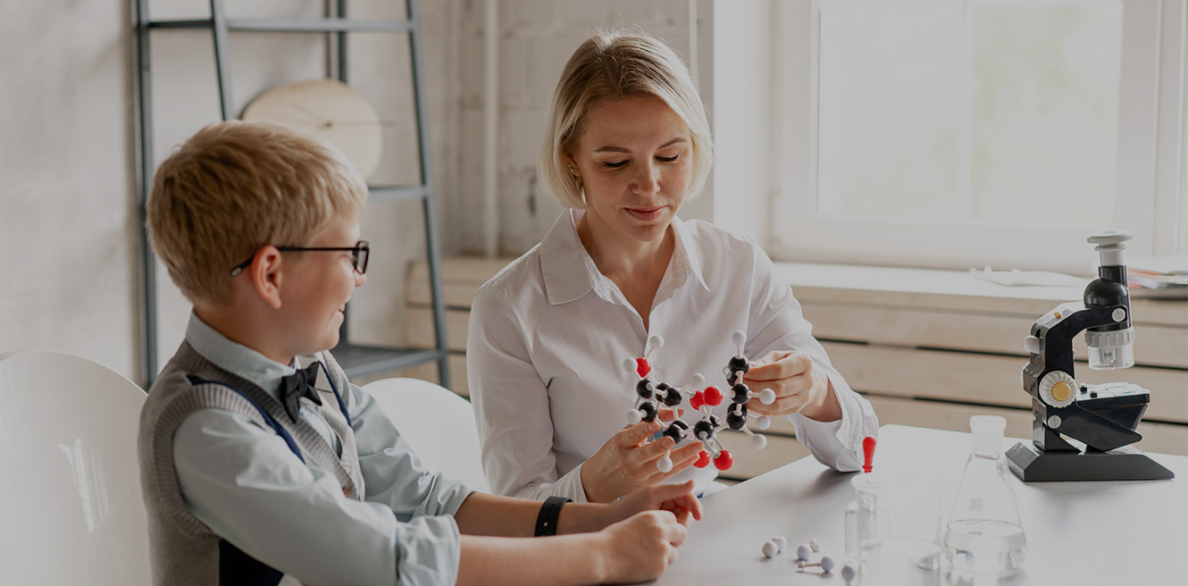 Female science tutor in Round Rock studying chemistry with student