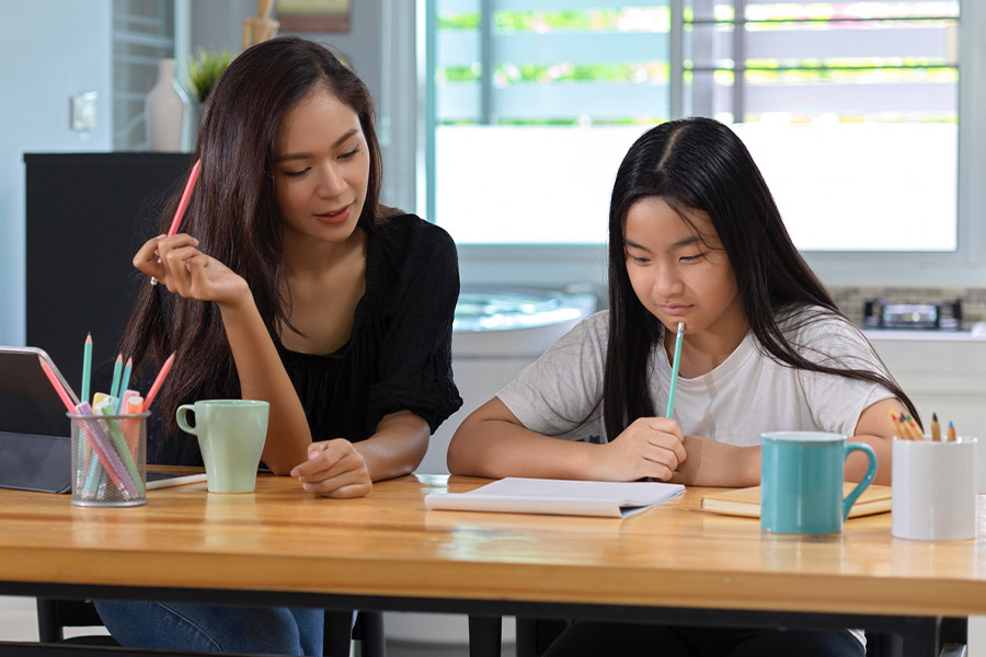 student and tutor together at a desk in Round Rock